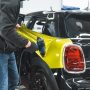"Technician performing professional detailing on a car, showcasing PRO LINE’s premium shine and finish"